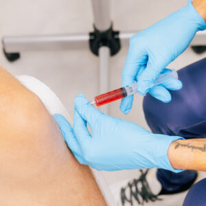 A gloved provider performs regenerative injection therapy in Mishawaka