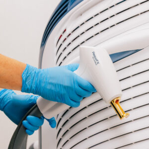 A gloved provider prepares one of our laser skin treatments in Mishawaka