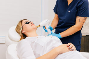 A patient lies back and receives skin resurfacing in Mishawaka
